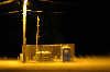 yellow outhouse at night